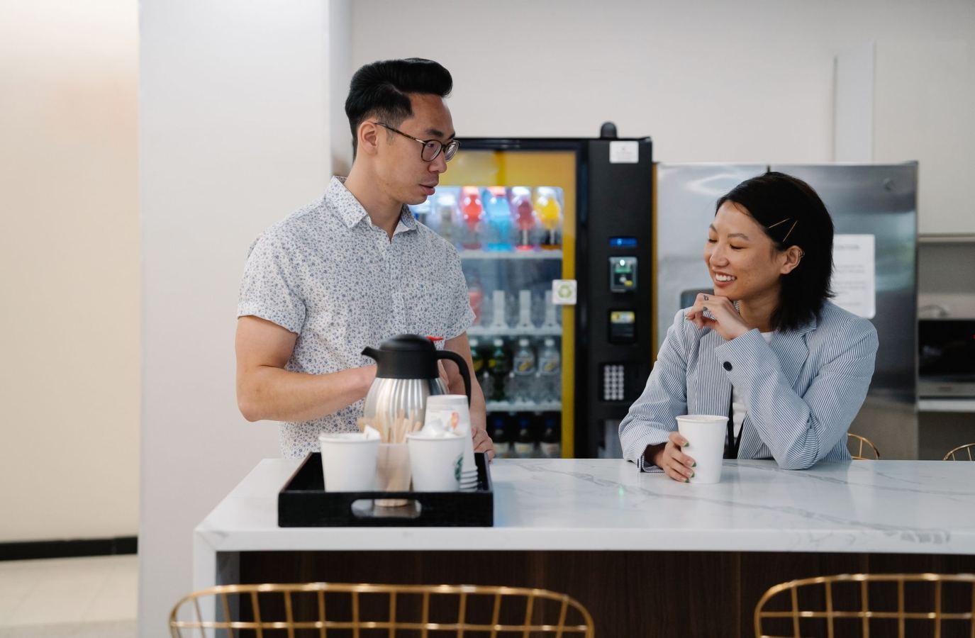 Glass front drink machine in a bright lobby